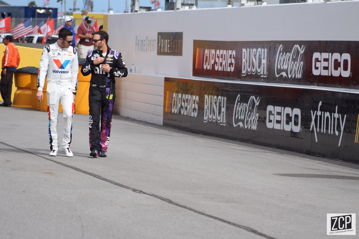 Alex Bowman walking with Jimmie Johnson at Daytona Speedweeks in 2020, before Bowman took over Johnson's No. 48 car