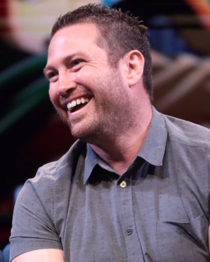 Bryce Papenbrook speaking on a panel at Phoenix Fan Fusion in 2023