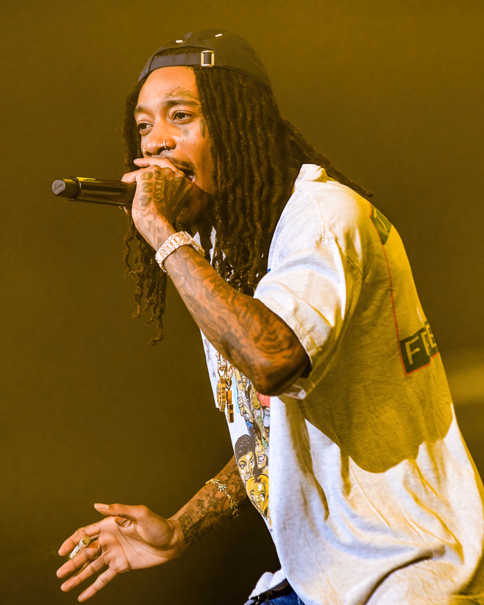 Wiz Khalifa performing on stage in 2023